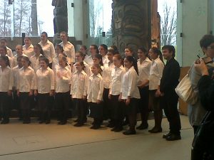 Iman Habibi and BC Girls' Choir after the performance of Lullaby of Hiroshima at the Museum of Anthropology